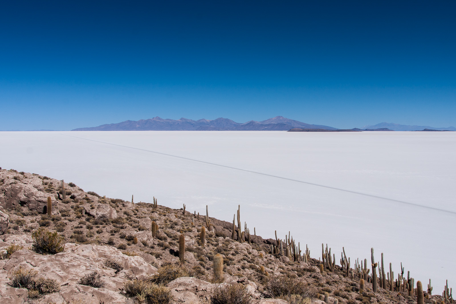 Whilst the salt may be unusually flat, this is still high up in the Andes. Volcanoes and other mountains can soar up to 2,000 metres higher. Here I’m a mere 100 metres higher.