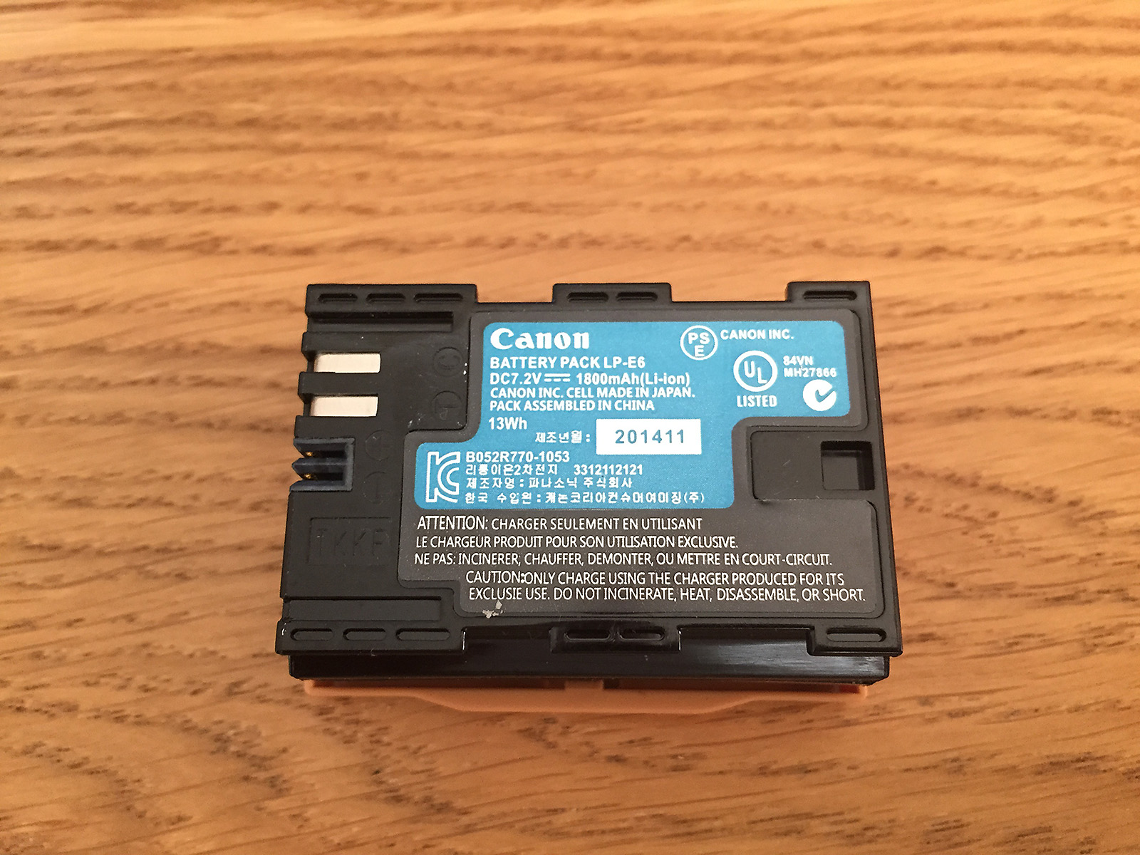 Can you spot why this Canon battery pack is not the real thing...?